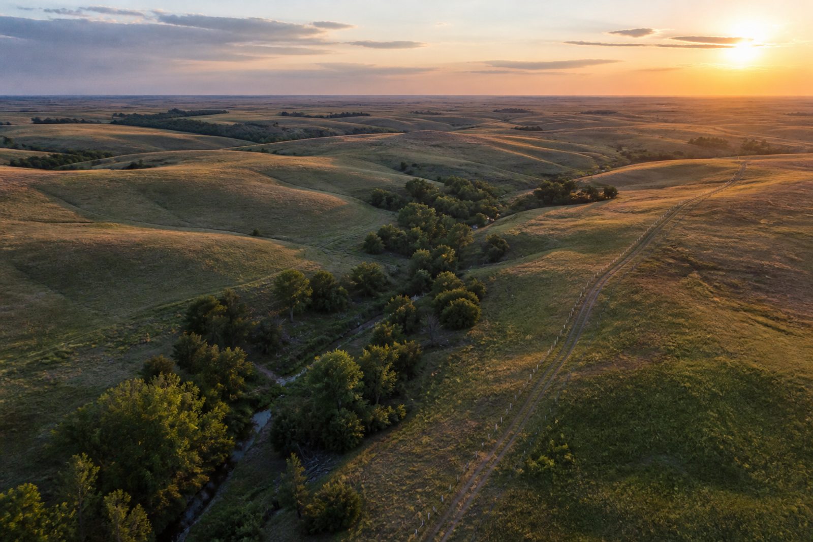 Aerial view of Kansas farmland and river at golden hour